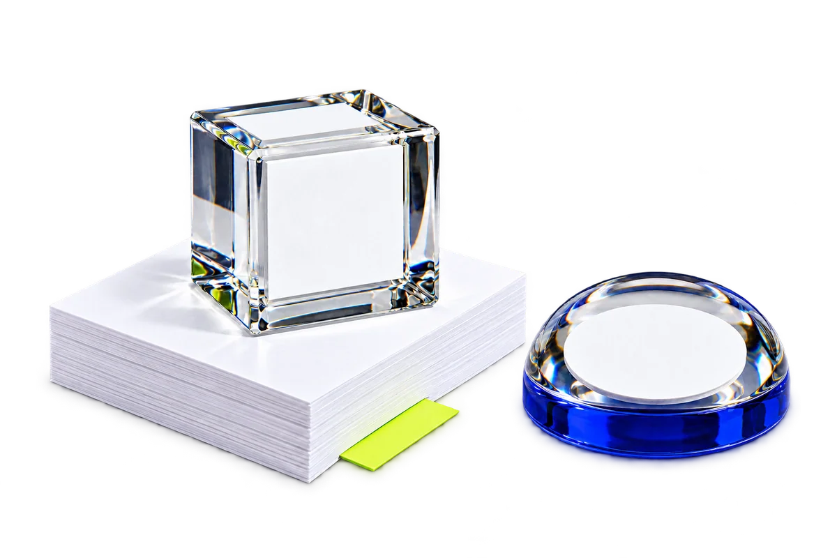 Illustrative crystal and glass paperweight designs